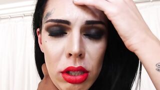 Tattooed tranny Gaby Ink tugging her big swollen cock