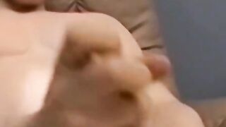 Horny and muscular guy wanks off huge dick until he cums a lot