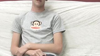 On a couch by himself cute gay man Danny jerks off his dick