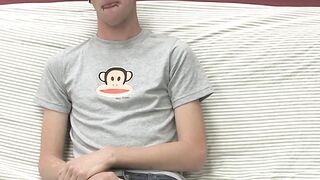 On a couch by himself cute gay man Danny jerks off his dick