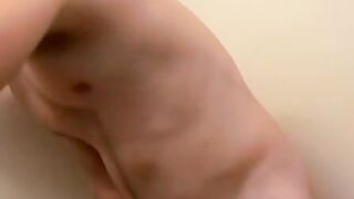 Gorgeous dude Potter gives his huge cock attention in the bathroom solo
