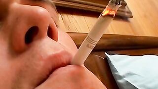 Cocky smoker Bryce Corbin smokes cig while gently stroking his cock