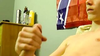 Young American strokes his dick and cum blasts