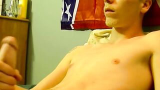 Young American strokes his dick and cum blasts