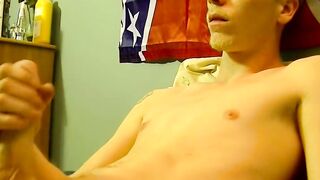 Young American strokes his dick and cum blasts