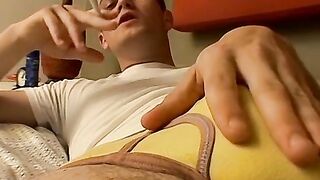 Hardcore smoker Bryce Corbin jerks in bed and blows warm hot cum on his chest