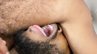 Restrained black stud deepthroated by dominant gay stud