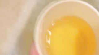 Japanese dollface tops a cup off with her pee and records it
