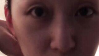 Japanese dollface tops a cup off with her pee and records it