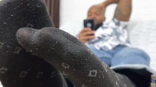 Hunky Dallas shows off his nice size twelve feet while relaxing