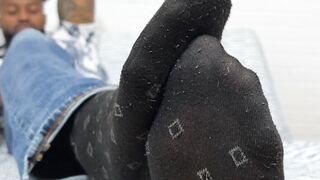 Hunky Dallas shows off his nice size twelve feet while relaxing
