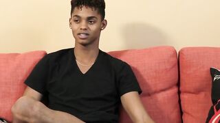 Dark young fellow gives a meeting and invigorates himself