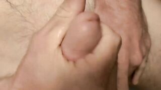 Handsome guy Nolan double fisting his big cock and jerking off til he cums