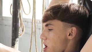 Twink Jacob Moon gets tied up on the air while enduring a rough anal drilling