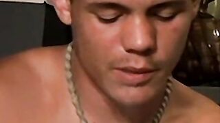 Handsome guy with necklace blow his smoke and spills his cum