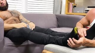 Muscular Zeek P has his feet sucked and worshiped by hunky Ray H