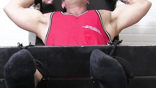 Muscular jock endures hardcore feet tickling with gloves