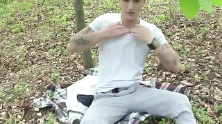 ToeSuckingDudes.com - Tattooed euro jock rubbing his toes and cock in the woods