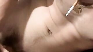 Tattooed dude ejaculating and smoking fun til he cums