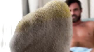 Bearded solo hunk admires his own feet while being recorded
