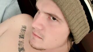 Tattooed jock wanks his hairy dick until he's ready to cum