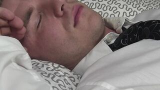 Hunk is asleep while man sniffs and licks his feet and toes