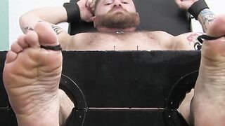 Muscular jocks tied and repeatedly tickled on smelly feet