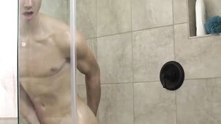 While wanking off in the shower wild twink Nathan stuffs dildo