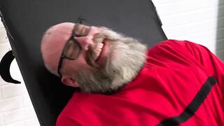 Giant Rick enjoys being tickled with his huge size thirteen feet by a hairy guy