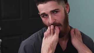 Doctor masturbates while bearded patient licks his feet