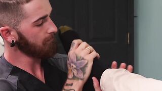 Doctor masturbates while bearded patient licks his feet