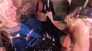 EU lesbians into rubber sharing a sex toy