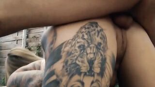 Inked young woman gets nailed outdoor