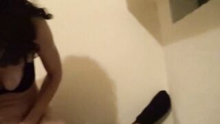 Masked amateur with brown curls inside homemade