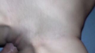 Masked amateur with brown curls inside homemade