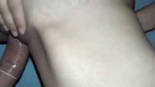 Masked amateur with brown curls inside homemade