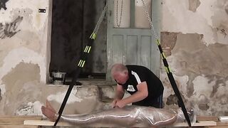 Young kinky slave is helpless and tied up during a handjob