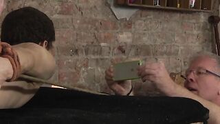 Bound slave wax tormented while being spanked and stroked