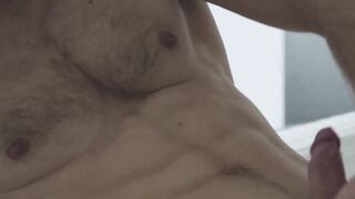 Handsome muscled jock Sam Cuthan jerks off his thick cock