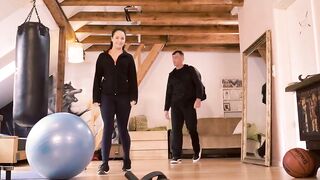 Fitness coach seduces young woman while doing sports