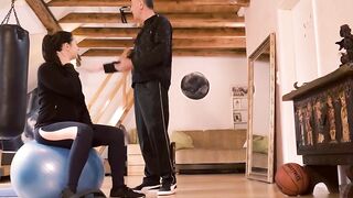 Fitness coach seduces young woman while doing sports