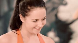 Fitness coach seduces young woman while doing sports