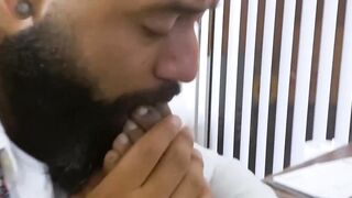 Bearded black stud licks his bosses feet while masturbating