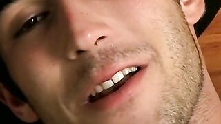 Hottie Cody lights his red cig while stroking his pinkish cock