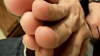 Handsome straight boy Bryce Corbin strokes his naked feet and big dick