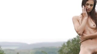 Beautiful teen Demi Fray reveals her mouth watering body in the grass