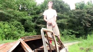 Cute straight guy Sean Johansen works on his dick in nature