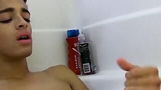 Twink jerks off and fingers his tight asshole while bathing