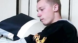 Twink savors the pleasure of smoking and stroking cock