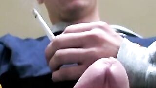 Twink savors the pleasure of smoking and stroking cock